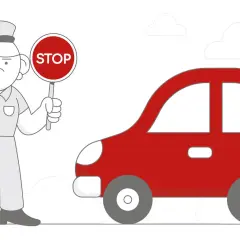 Policja po cywilnemu zatrzymała czerwony samochód.
