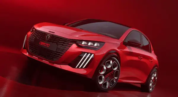 Czerwony, sportowy hatchback Peugeot 208 GTI z agresywnym grillem i felgami.