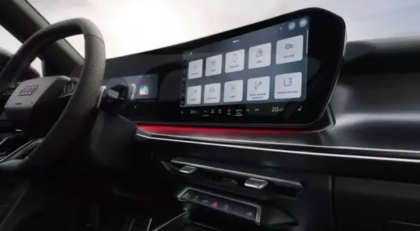 Nowoczesne audi q3 sportback wnętrze z dużym ekranem dotykowym, nawigacją, radiem i innymi funkcjami.