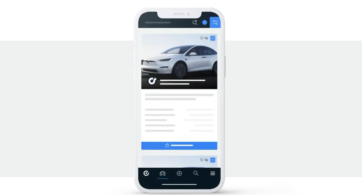 Aplikacja mobilna pokazująca białe auto. Tu handlarze kupują auta w Niemczech, szukając okazji.