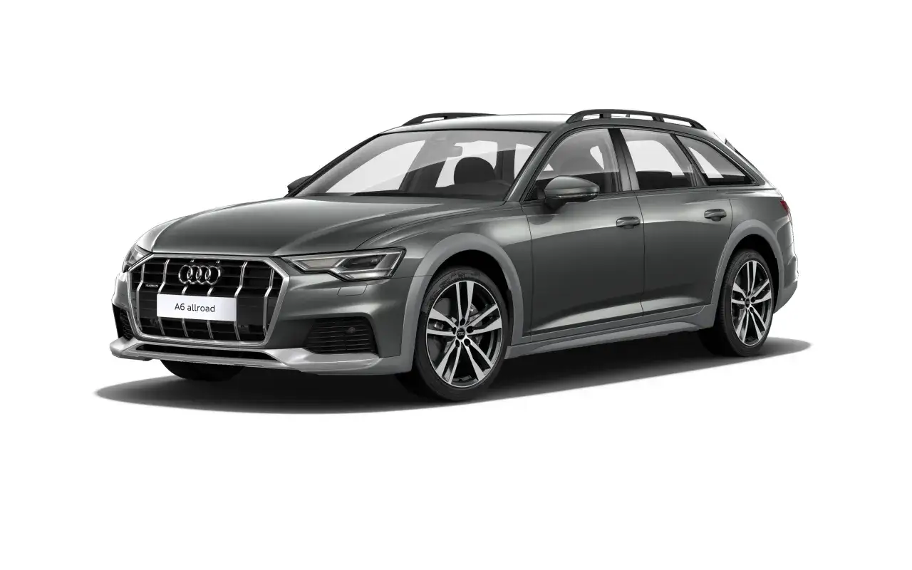 Szare Audi A6 allroad, idealne auto na długie trasy, z relingami dachowymi i eleganckimi felgami.
