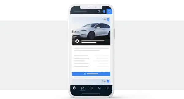 Aplikacja mobilna pokazująca białe auto. Tu handlarze kupują auta w Niemczech, szukając okazji.