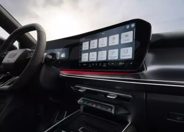 Nowoczesne audi q3 sportback wnętrze z dużym ekranem dotykowym, nawigacją, radiem i innymi funkcjami.